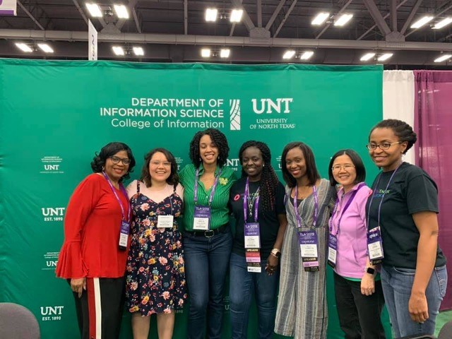 Students, alums, faculty at TLA booth