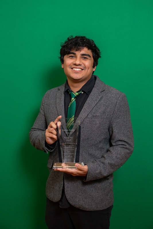 Mathew Zuniga holding award